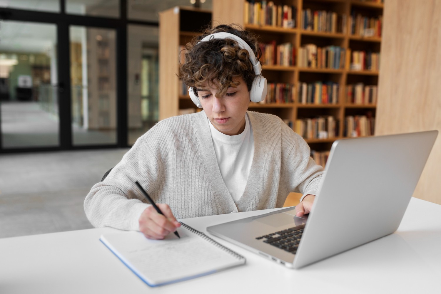 A young student studying in the library